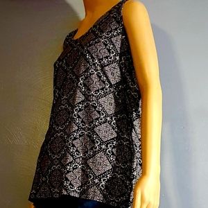 Women's top with a long sleeveless sweater dress.